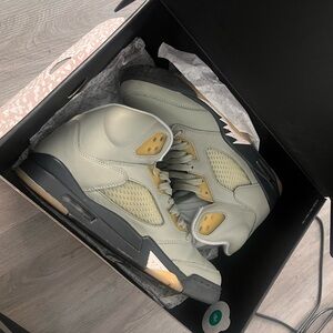 Jordan Cream and Gold Athletic Shoes with Shark Tooth Design